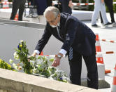 Russian Ambassador to Japan Mikhail Galuzin lays flowers at the cenotaph for atomic bomb victims at the Peace Memorial Park in Hiroshima, western Japan, Thursday, Aug. 4, 2022. Russia and its ally Belarus were not invited to this year's peace memorial. Russian Ambassador to Japan Galuzin on Thursday offered flowers at a memorial epitaph in the park and told reporters his country would never use nuclear weapons.(Shingo Nishizume/Kyodo News via AP)