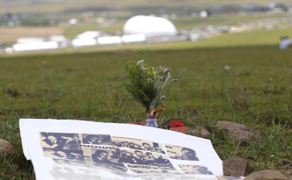 A memorial for South Africa's late President Nelson Mandela, left behind by villagers, is seen on a hill above the graveyard within the Mandela family's property in the village of Qunu