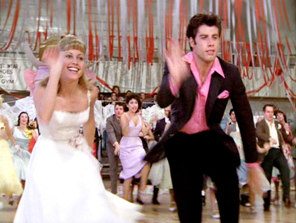 LOS ANGELES - JUNE 16: The movie "Grease", directed by Randal Kleiser. Seen here at high school dance (from left) Olivia Newton-John as Sandy and John Travolta as Danny Zuko. Initial theatrical release of the film, June 16, 1978. Screen capture. Paramount Pictures. (Photo by CBS via Getty Images)