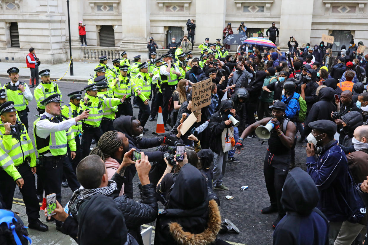 Police clash with protesters during a Black Lives Matter protest rally in Westminster, London, in memory of George Floyd who was killed on May 25 while in police custody in the US city of Minneapolis.