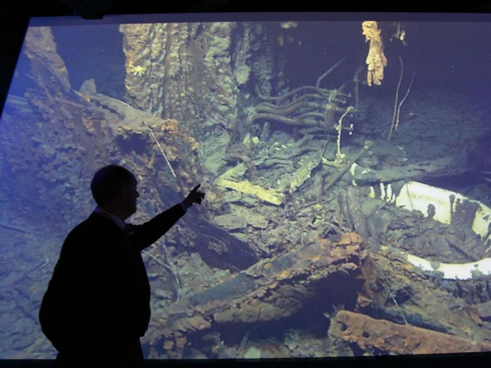 Professor Robert Ballard, professor of oceanography at the University of Rhode Island, points to his footage of the wreck of the Titanic that is part of the exhibition on display in the Belfast Building, Northern Ireland, Saturday, April 14, 2012. Ballard and his team discovered the wreck of the Titanic in 1985.