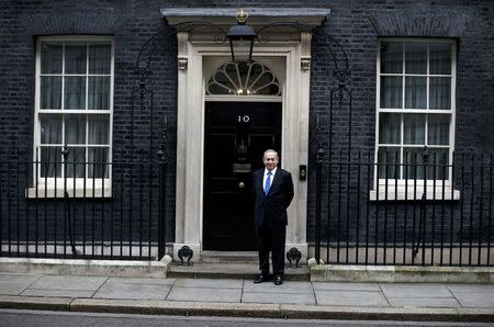 Israel's Prime Minister Benjamin Netanyahu stands alone on the doorstep of 10 Downing Street as he arrives to visit Britain's Prime Minister Theresa May in London, February 6, 2017. REUTERS/Peter Nicholls