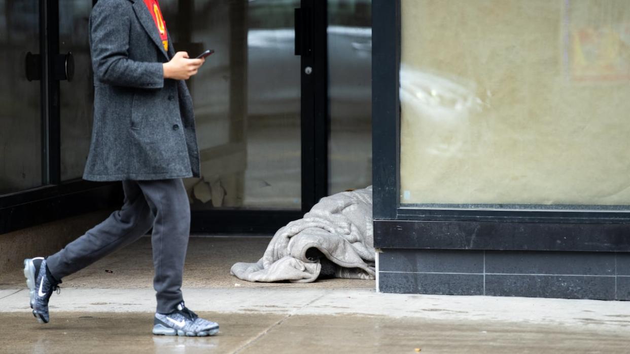 The federal government announced Friday it's offering the Graham Spry Building on Lanark Avenue in Ottawa's Westboro neighbourhood 'as a temporary emergency overnight centre for those seeking refuge from the cold.' (Andrew Lee/CBC - image credit)