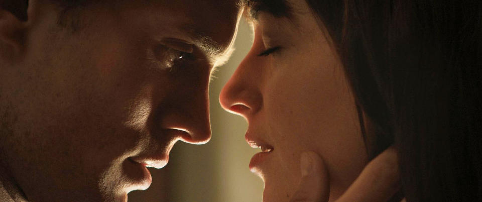 Jamie Dornan as Christian Grey, and Dakota Johnson as Anastasia Steele in 