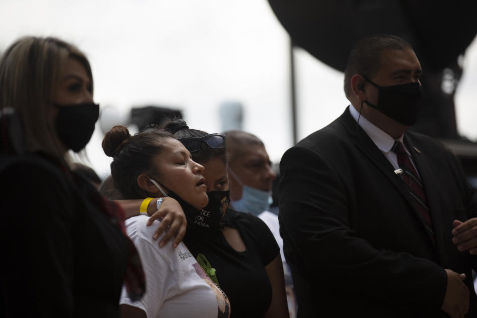 Gloria Guillen accompanied by her children arrives at Cesar Chavez High School to attend a public memorial service for her daughter Army Spc. Vanessa Guillen on Friday, Aug. 14, 2020, in Houston. Guillen, who was last seen on April 22, was laid to rest nearly four months after she is said to have been killed by a fellow soldier at Fort Hood, a U.S. Army base in Texas. (Marie D. De Jesus/Houston Chronicle via AP)