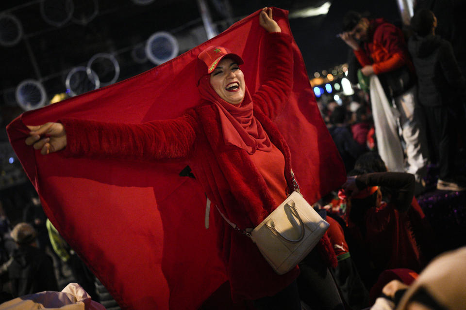 FILE - Morocco fans in Marseille, southern France, celebrate after victory over Spain in the round of 16 soccer match between Morocco and Spain, Tuesday, Dec. 6, 2022. (AP Photo/Daniel Cole, File)