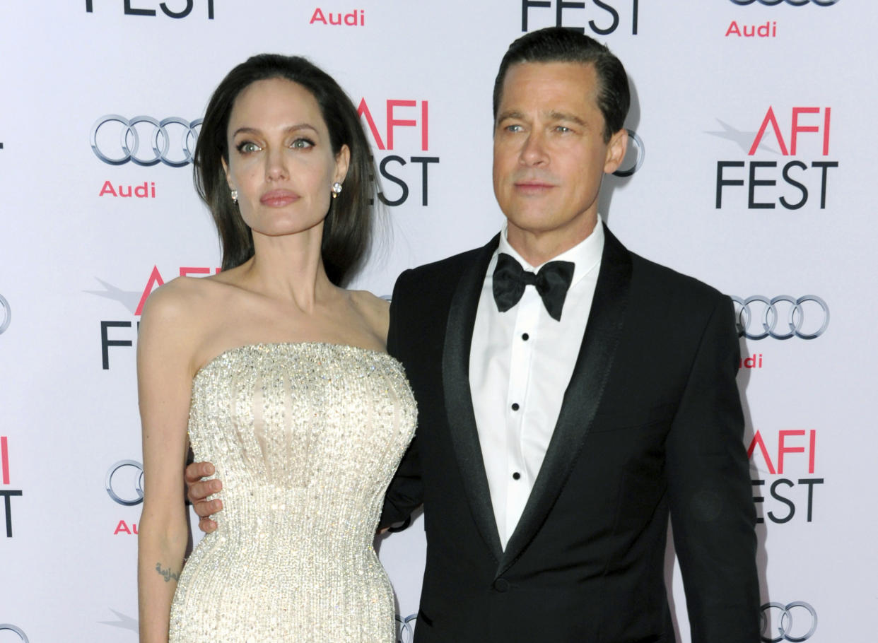 FILE - In this Nov. 5, 2015 file photo, Angelina Jolie, left, and Brad Pitt arrive at the 2015 AFI Fest opening night premiere of 