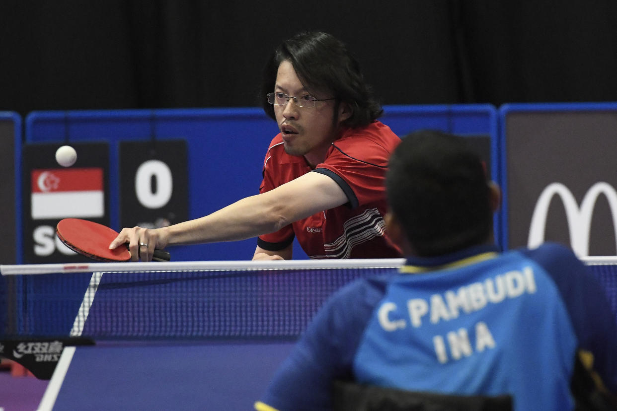 Darren Chua competes against Indonesia’s C Pambudi in the Para Table Tennis match held at MiTEC Hall 7 during the 9th ASEAN Para Games on 17 September, 2017, in Kuala Lumpur, Malaysia. (PHOTO: Getty Images)