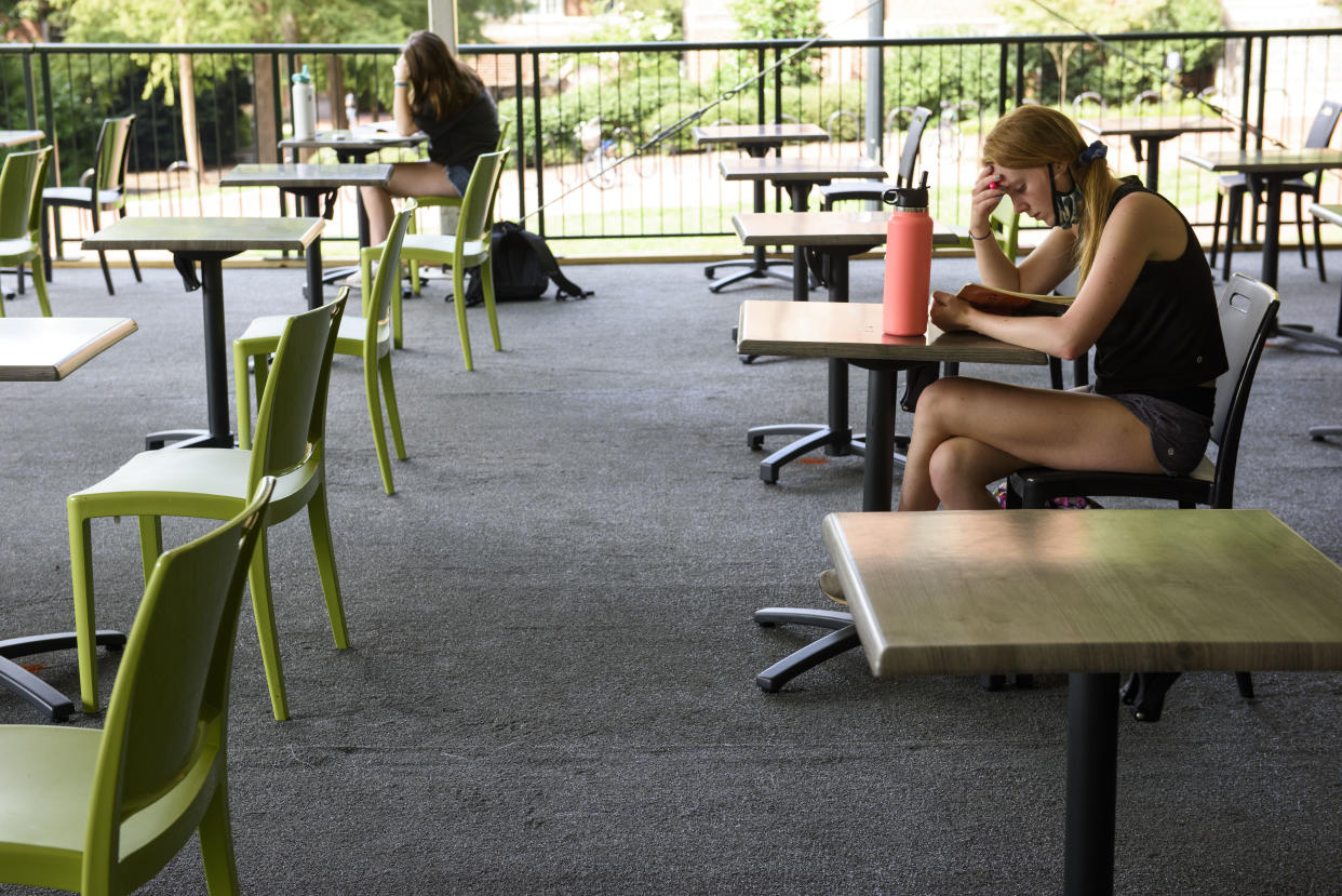 A student studies in an open-air seating area on the campus of the University of North Carolina at Chapel Hill on August 18, 2020 in Chapel Hill, North Carolina. (Photo by Melissa Sue Gerrits/Getty Images)