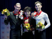 Figure Skating - Skate America, Award Ceremony, Hoffman Estates, Illinois, U.S., 23/10/16. First place winner of the men free skating Shoma Uno of Japan (C), second place Jason Brown (L) of United States, and third place Adam Rippon (R) of United States, pose with their medals during the awards ceremony at the Skate America competition. REUTERS/Kamil Krzaczynski