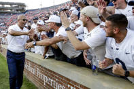 Penn State head coach James Franklin celebrates with fans after their victory over Auburn in an NCAA college football game, Saturday, Sept. 17, 2022, in Auburn, Ala. (AP Photo/Butch Dill)