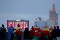 People gather at the Liberty Memorial as they wait for a parade through downtown Kansas City, Mo. to celebrate the Kansas City Chiefs victory in NFL's Super Bowl 54 Wednesday, Feb. 5, 2020. (AP Photo/Charlie Riedel)