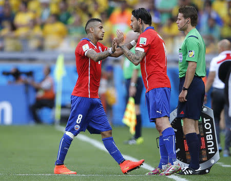 No. 10 - THE CROSSBAR. In the dying seconds of extra time with the score at 1-1 in their last-16 game, Chile striker Mauricio Pinilla hit a thunderous shot that rattled off the crossbar to leave Brazil counting their lucky stars as they went to penalties. Chile lost the shootout, but had Pinilla's shot gone just slightly lower, he would have become a national hero by overturning a painful history of defeats by Brazil. REUTERS/Sergio Perez