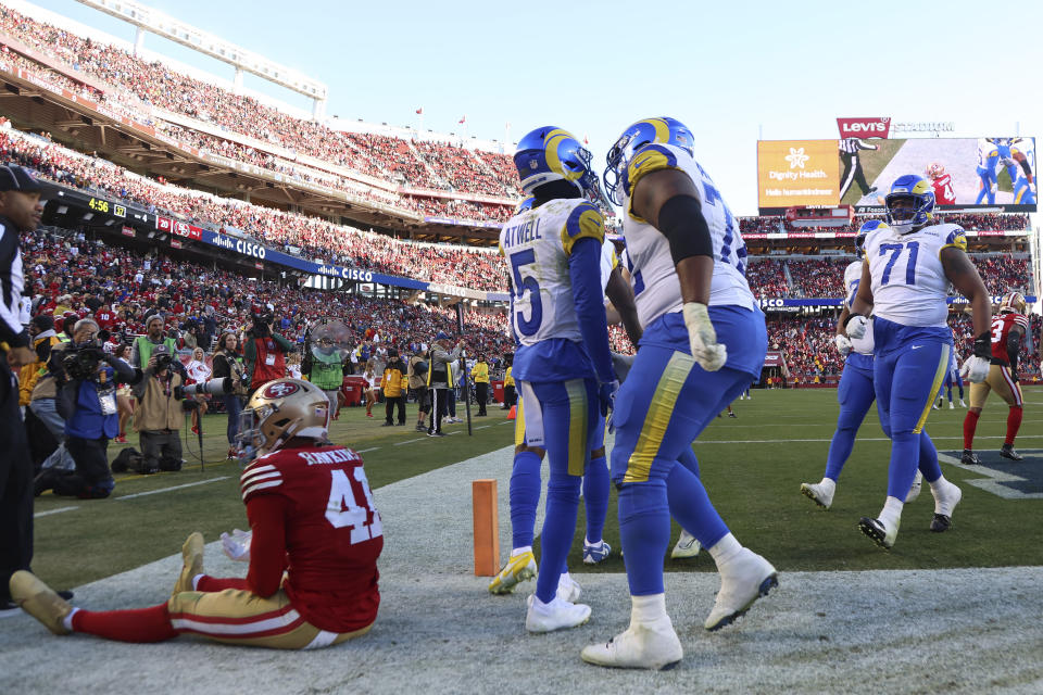 San Francisco 49ers safety Tayler Hawkins (41) reacts as Los Angeles Rams wide receiver Tutu Atwell (5) celebrates with teammates after scoring on a two point conversion during the second half of an NFL football game in Santa Clara, Calif., Sunday, Jan. 7, 2024. (AP Photo/Jed Jacobsohn)