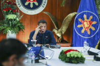In this photo provided by the Malacanang Presidential Photographers Division, Philippine President Rodrigo Duterte talks to members of the Inter-Agency Task Force on the Emerging Infectious Diseases at the Malacanang presidential palace in Manila, Philippines Thursday, July 30, 2020. (Simeon Celi Jr./ Malacanang Presidential Photographers Division via AP)