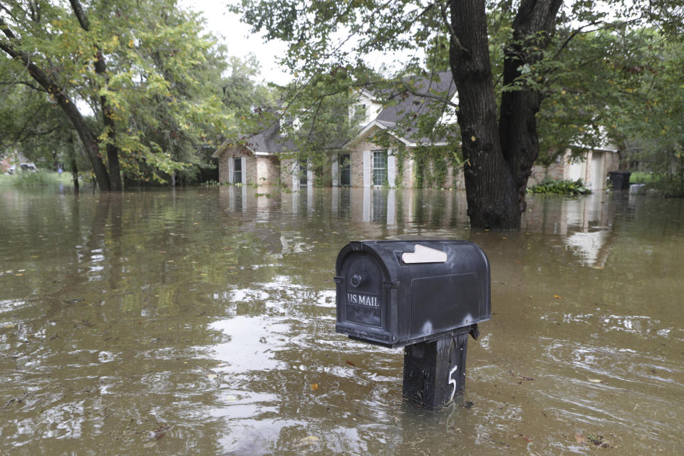 A home on Kingsmill Road has water up to its windows after the Clear Creek overflowed as Tropical Storm Beta rained over the area Tuesday, Sept. 22, 2020, in Friendswood, Texas. Beta has weakened to a tropical depression as it parked itself over the Texas coast, raising concerns of extensive flooding in Houston and areas further inland. (Steve Gonzales/Houston Chronicle via AP)