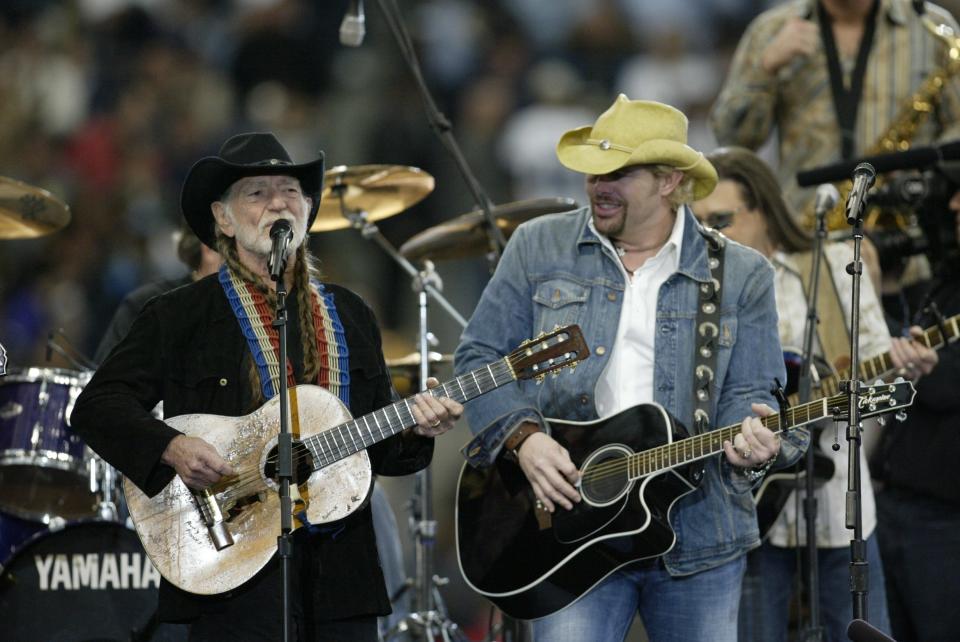 Willie Nelson and Toby Keith perform during the Super Bowl XXXVIII pregame on Feb. 1, 2004 in Houston, Texas.