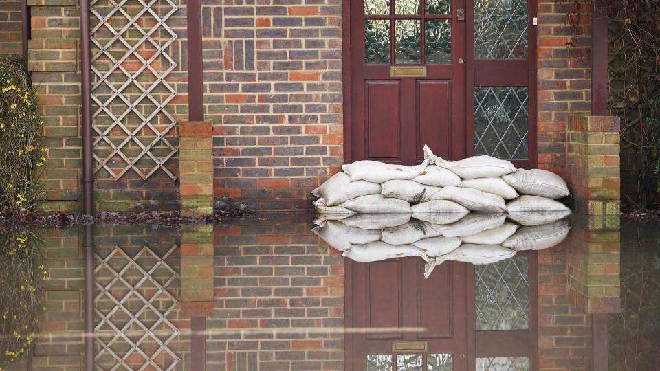 Sandbags Outside Front Door Of Flooded House - Image.
