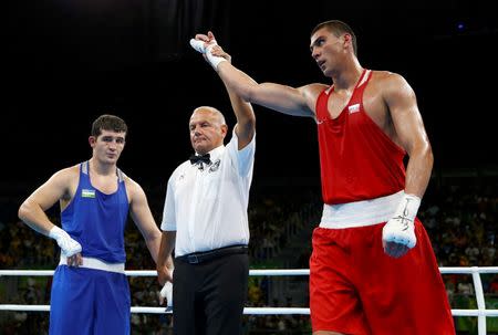 2016 Rio Olympics - Boxing - Semifinal - Men's Heavy (91kg) Semifinals Bout 158 - Riocentro - Pavilion 6 - Rio de Janeiro, Brazil - 13/08/2016. Evgeny Tishchenko (RUS) of Russia reacts after winning his bout against Rustam Tulaganov (UZB) of Uzbekistan. REUTERS/Peter Cziborra