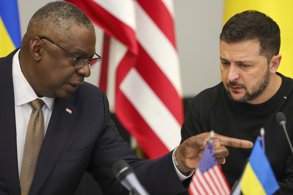 FILE - U.S. Secretary of Defense Lloyd Austin, left, speaks with Ukraine's President Volodymyr Zelenskyy during the Ukraine Defense Contact Group meeting of NATO defense ministers at NATO headquarters in Brussels, Oct. 11, 2023. Ukraine has used U.S weapons to attack inside Russia in recent days. That's according to a Western official familiar with the matter. The weapons were used under recently approved guidance from President Joe Biden allowing American arms to be used to strike inside Russia for the limited purpose of defending Kharkiv, Ukraine’s second-largest city. (Olivier Matthys, Pool Photo via AP, File)