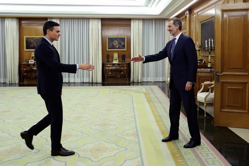 Spain's King Felipe greets acting PM Sanchez before their meeting in Madrid