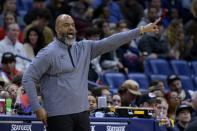 Washington Wizards head coach Wes Unseld Jr. gestures against the New Orleans Pelicans in the first half of an NBA basketball game in New Orleans, Saturday, Jan. 28, 2023. (AP Photo/Matthew Hinton)