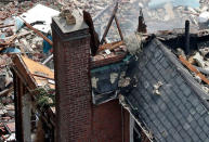 <p>Debris is seen scattered around at the scene of a house explosion, Tuesday, Sept. 27, 2016, in the Bronx borough of New York. (AP Photo/Mary Altaffer) </p>