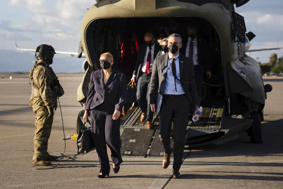 FILE - Tina Flournoy, chief of staff to the Vice President, and Mazin Alfaqi, special adviser to the Vice President for the Northern Triangle, walk from a chinook helicopter to board Air Force Two to return to Washington, Thursday, Jan. 27, 2022, in Palmerola, Honduras. Vice President Kamala Harris is naming Lorraine Voles as her new chief of staff, replacing Tina Flournoy who is leaving the administration, in the latest shakeup in her office, the White House said. (Erin Schaff/The New York Times via AP, Pool)