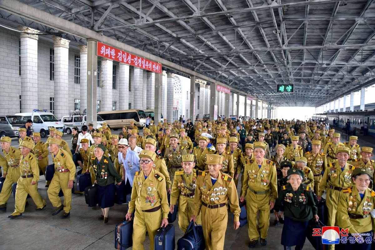 Participants attending the 70th anniversary commemorations of the Korean War armistice arrive in Pyongyang (via REUTERS)