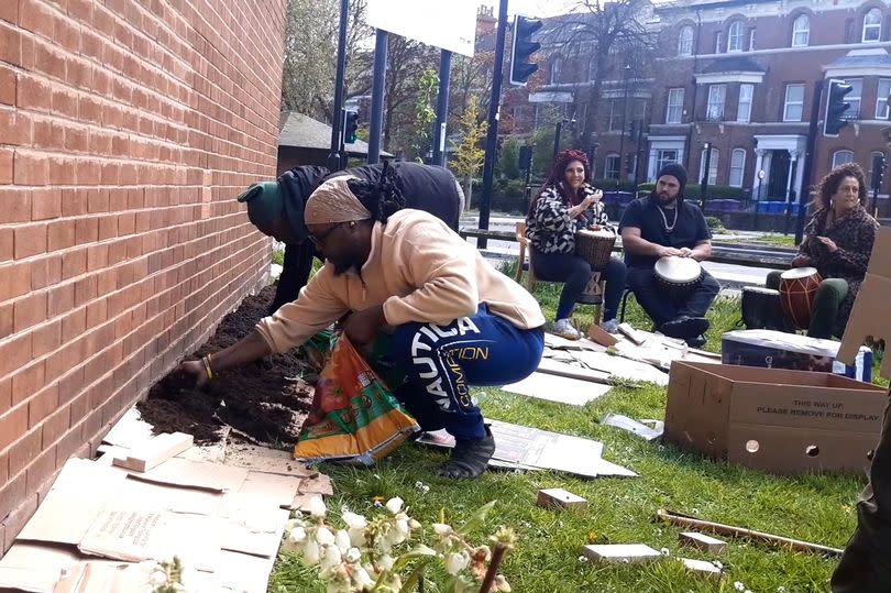 Addae G spreading compost on cardboard as part of the no dig planting at the Postcode Gardener Healing Garden event (Image: Patrick Graham/Liverpool ECHO)