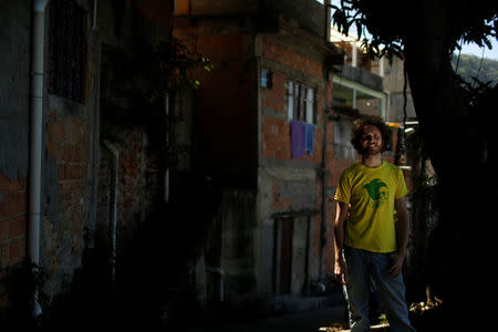 British musician Tom Ashe poses for a photograph near the building where he is renting a room, in Pereira da Silva favela, in Rio de Janeiro, Brazil, May 2, 2016. REUTERS/Pilar Olivares