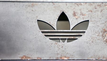 The Adidas logo on an iron bench is pictured at the flagship store in Berlin, Germany, January 20, 2016. REUTERS/Hannibal Hanschke