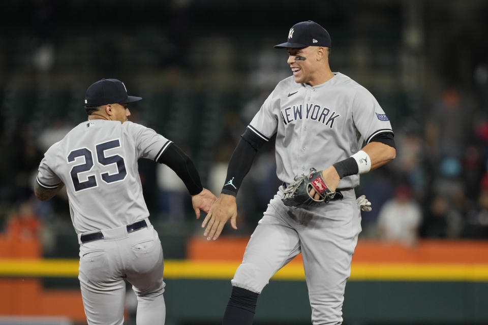 New York Yankees second baseman Gleyber Torres (25) and right fielder Aaron Judge celebrate the team's win over the Detroit Tigers after the ninth inning of a baseball game, Wednesday, Aug. 30, 2023, in Detroit. (AP Photo/Carlos Osorio)