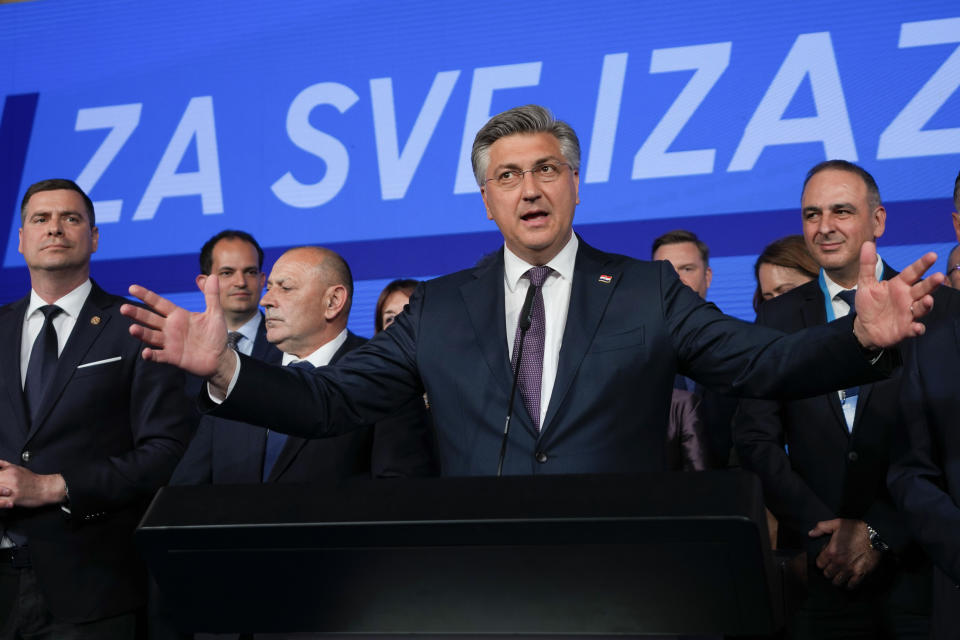 Prime Minister incumbent Andrej Plenkovic, center, speaks after claiming victory in a parliamentary election in Zagreb, Croatia, Thursday, April 18, 2024. Croatia's governing conservatives convincingly won a highly contested parliamentary election Wednesday, but will still need support from far-right groups to stay in power, according to the official vote count. The election followed a campaign that centered on a bitter rivalry between the country's president and prime minister. (AP Photo/Darko Vojinovic)