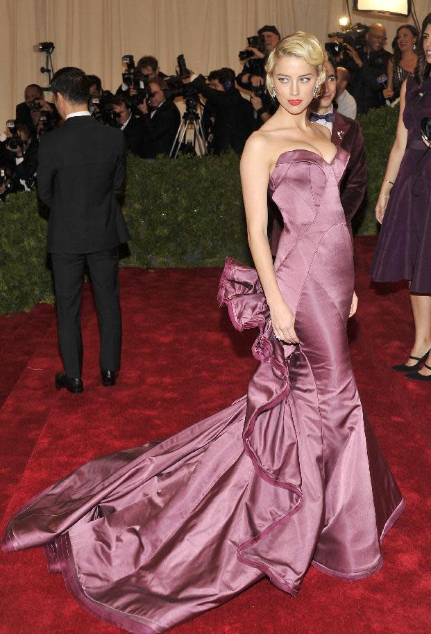 Amber Heard arrives at the Metropolitan Museum of Art Costume Institute gala benefit, celebrating Elsa Schiaparelli and Miuccia Prada, Monday, May 7, 2012 in New York. (AP Photo/Charles Sykes)