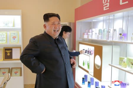 FILE PHOTO: North Korean leader Kim Jong Un visits a cosmetics factory in this undated photo released by North Korea's Korean Central News Agency (KCNA) in Pyongyang