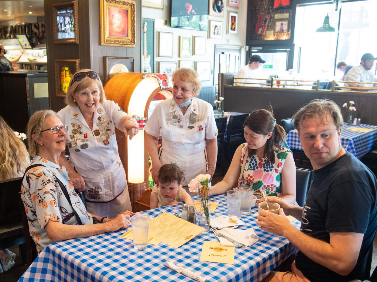 Customers being served at restaurant