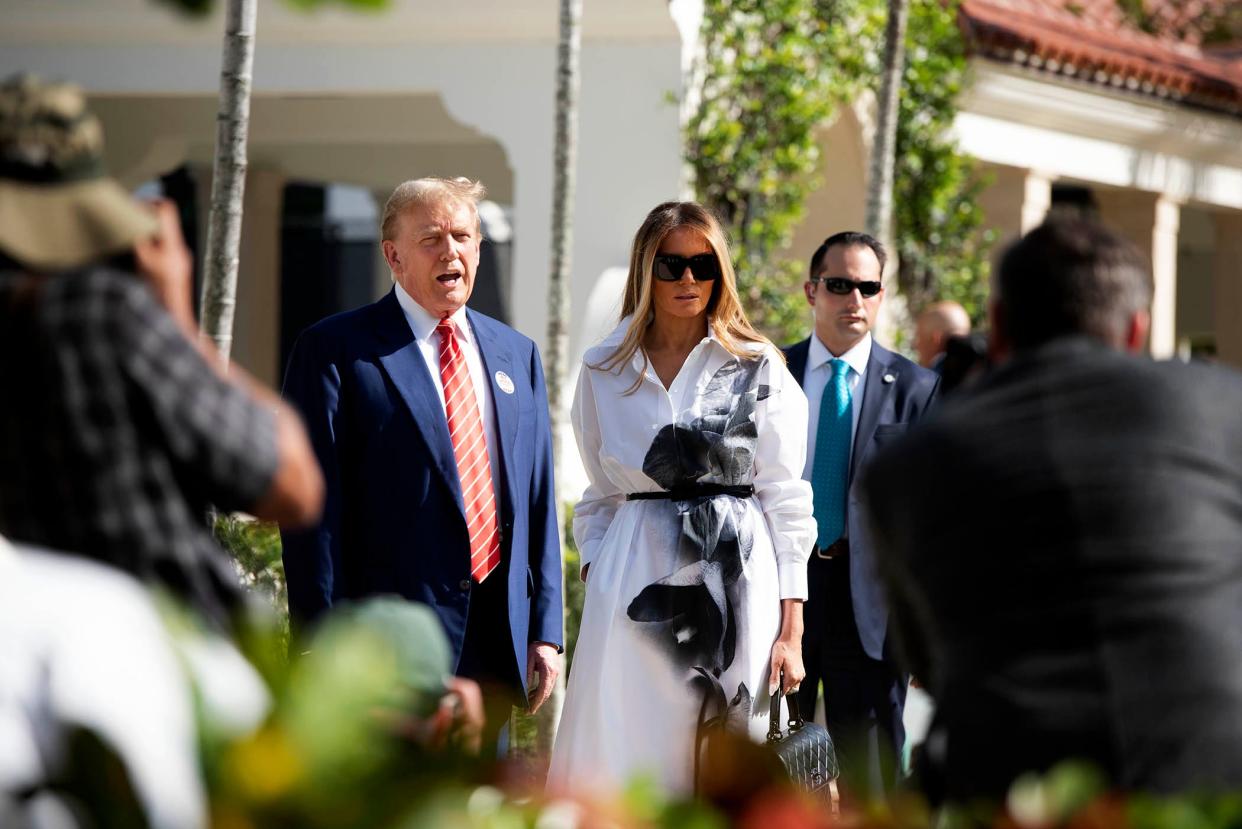 Donald and Melania Trump stand in front of members of the media after casting their votes at the Morton and Barbara Mandel Recreation Center on elections day March 19, 2024 Palm Beach.