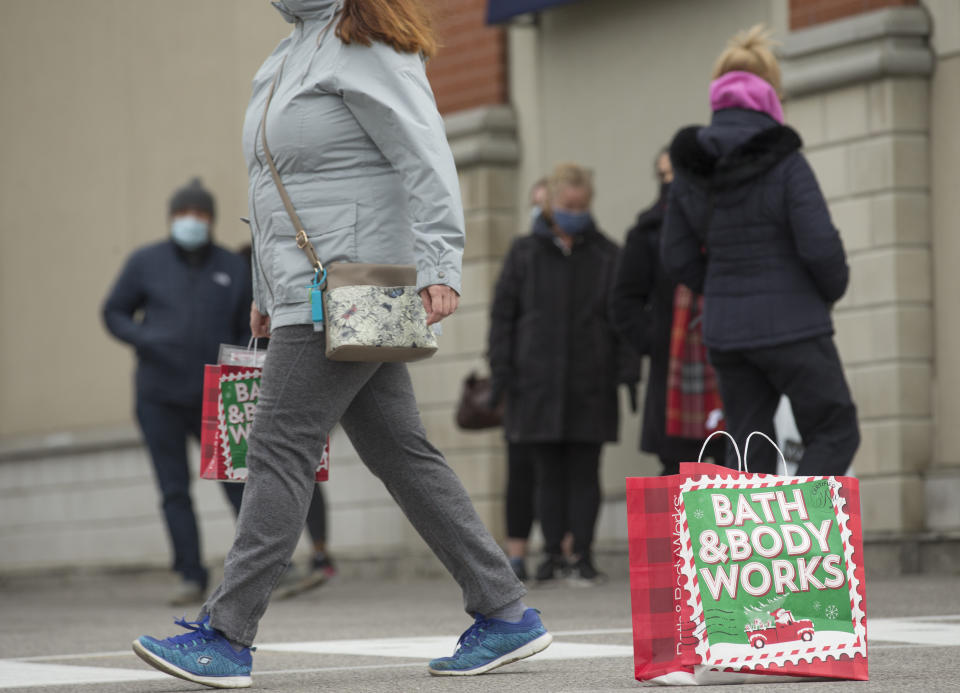 TORONTO, ON - NOVEMBER 21: Shoppers line up outside a Bath and Body Works store in Scarborough. With another lockdown about to start Monday, shoppers line up at local big box stores to get supplies before the economic slowdown. COVID-19. CORONAPD  Toronto Star/Rick Madonik        (Rick Madonik/Toronto Star via Getty Images)