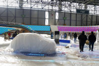 Workers dismantle a booth after that the 90th Geneva International Motor Show (GIMS) is cancelled by Swiss authorities, at the Palexpo in Geneva, Switzerland, Friday, Feb. 28, 2020. The 90th edition of the International Motor Show, scheduled to begin on March 5th, is cancelled due to the advancement of the (Covid-19) coronavirus in Switzerland. The Swiss confederation announced today that all events involving more than 1,000 people would be banned until 15 March. (KEYSTONE/Salvatore di Nolfi)