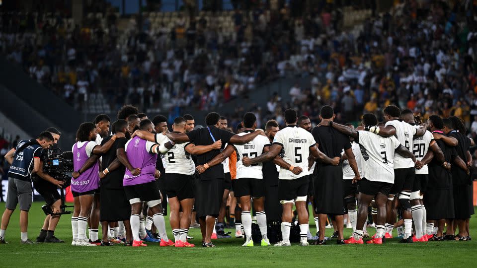 Fiji's players form a circle after defeating Australia for the first time in 69 years. - Olivier Chassignole/AFP/Getty Images