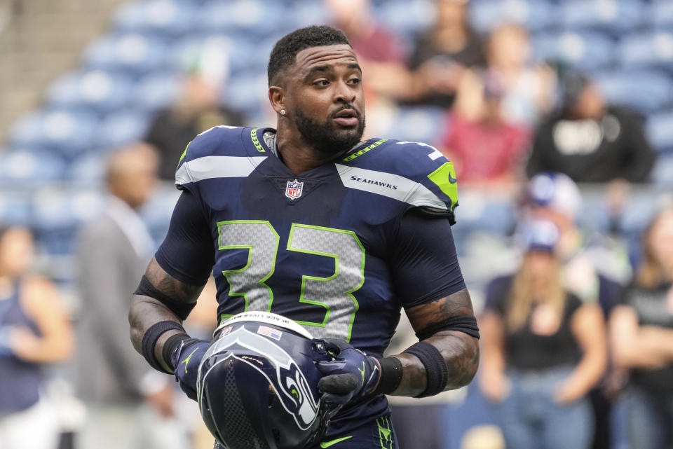 FILE - Seattle Seahawks defensive back Jamal Adams stands on the field before the team's NFL preseason football game against the Chicago Bears, Aug. 18, 2022, in Seattle. Nearly 13 months have passed since Adams limped off the field with another major injury, the worst one yet during his tenure with the Seahawks that’s so far been defined by injuries. But Adams is back. The ball of energy that’s spent a year watching is set to make his return on Monday night when the Seahawks play at the New York Giants. (AP Photo/Stephen Brashear, File)