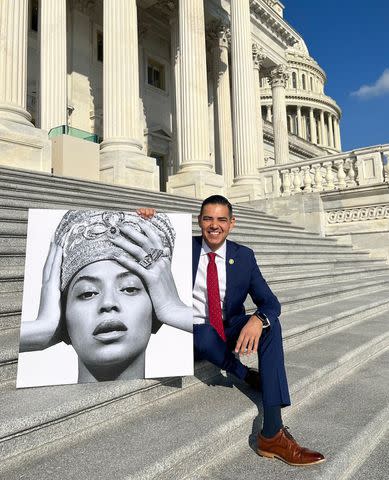 <p>Office of Congressman Robert Garcia</p> Rep. Robert Garcia poses with a photo of Beyoncé, which he displayed during a passionate speech on the House floor about her contributions