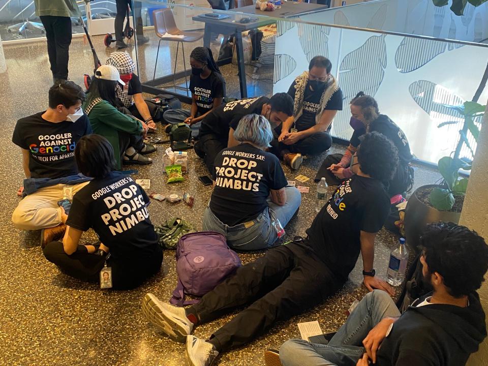 Google workers sitting in office