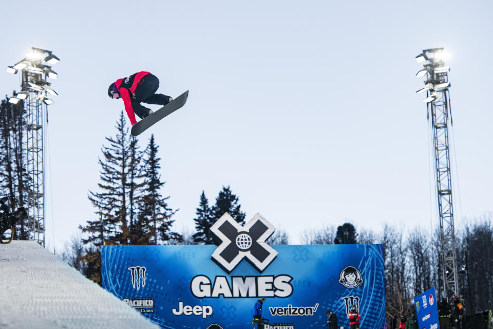 FILE -Elizabeth Hosking airs out of the superpipe during the women's finals at the Winter X Games on Saturday, Jan. 22, 2022, at Buttermilk in Aspen, Colo. ESPN sold its majority stake in the X and Winter X Games on Wednesday, Oct. 26, 2022 marking the end of a nearly three-decade chapter during which the network helped propel snowboarding, skateboarding and other action sports out of the fringe and into the mainstream.(Kelsey Brunner/The Aspen Times via AP, File)