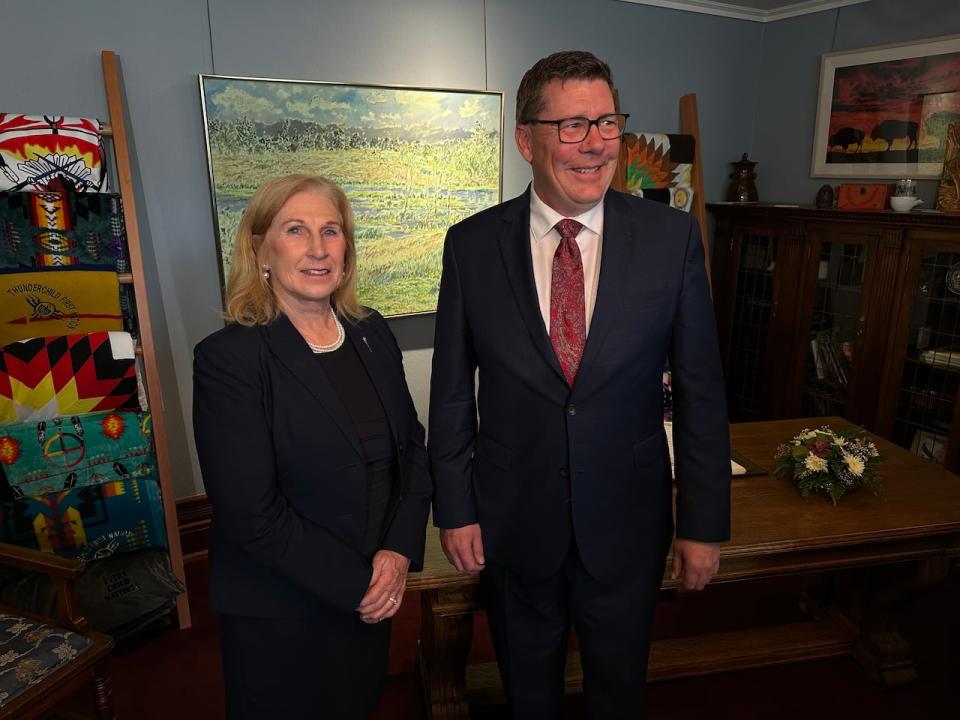 Colleen Young, Saskatchewan's Minister of Advanced Education, stands beside Premier Scott Moe after Young was sworn in to the new role on May 17, 2024. 