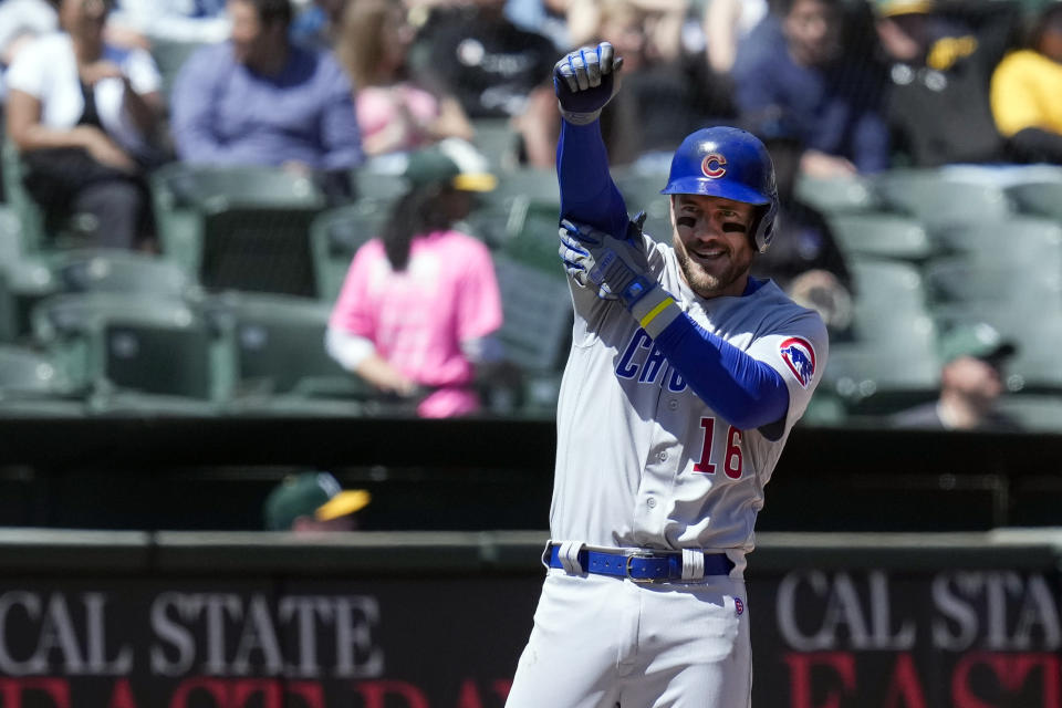 Chicago Cubs' Patrick Wisdom celebrates after hitting a two-run triple against the Oakland Athletics during the sixth inning of a baseball game in Oakland, Calif., Wednesday, April 19, 2023. (AP Photo/Godofredo A. Vásquez)