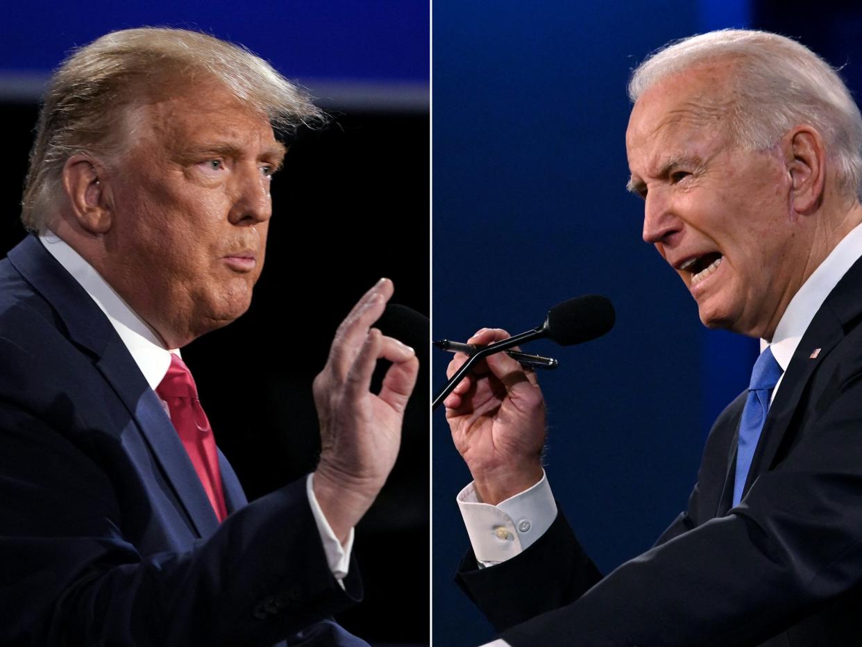 Donald Trump (L) and Joe Biden (R) during the final presidential debate at Belmont University in Nashville, Tennessee, on October 22, 2020. (Photo by Brendan Smialowski and JIM WATSON / AFP) (Photo by BRENDAN SMIALOWSKIJIM WATSON/AFP via Getty Images)