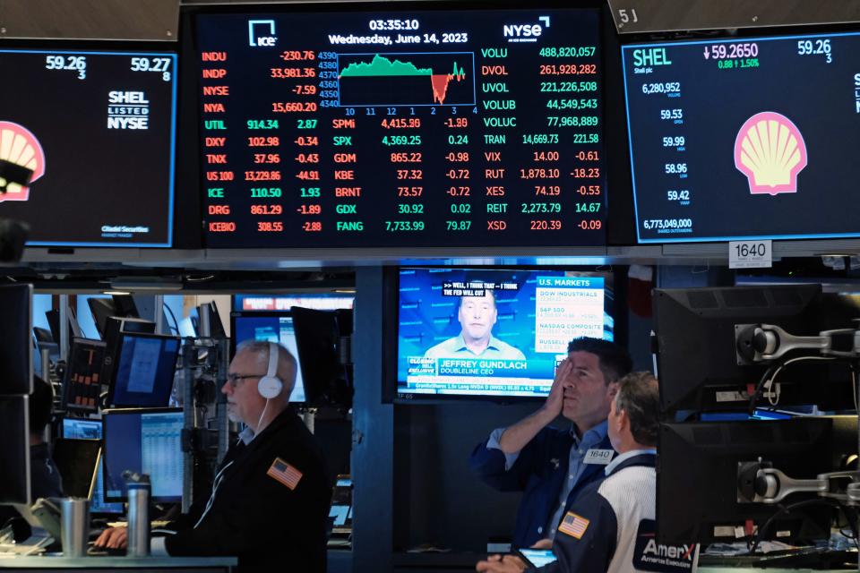 Traders work on the floor of the New York Stock Exchange (NYSE) on June 14, 2023 in New York City.