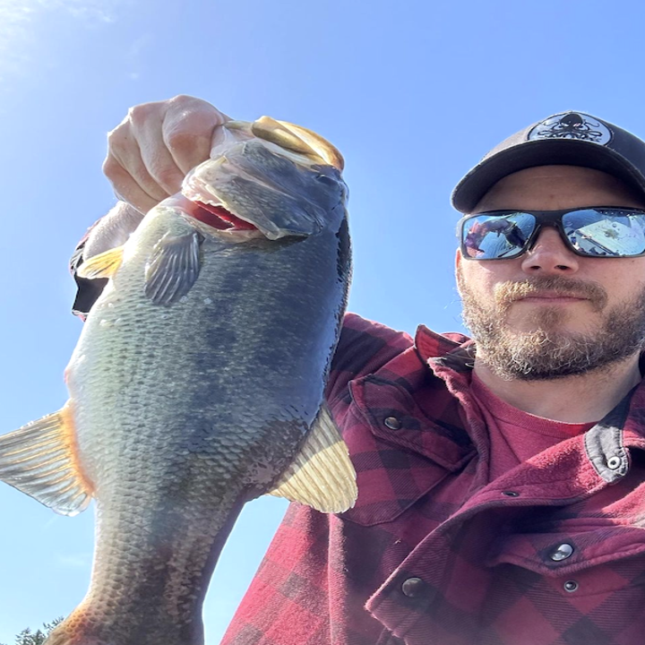 Closeup of Chris Pratt holding a fish